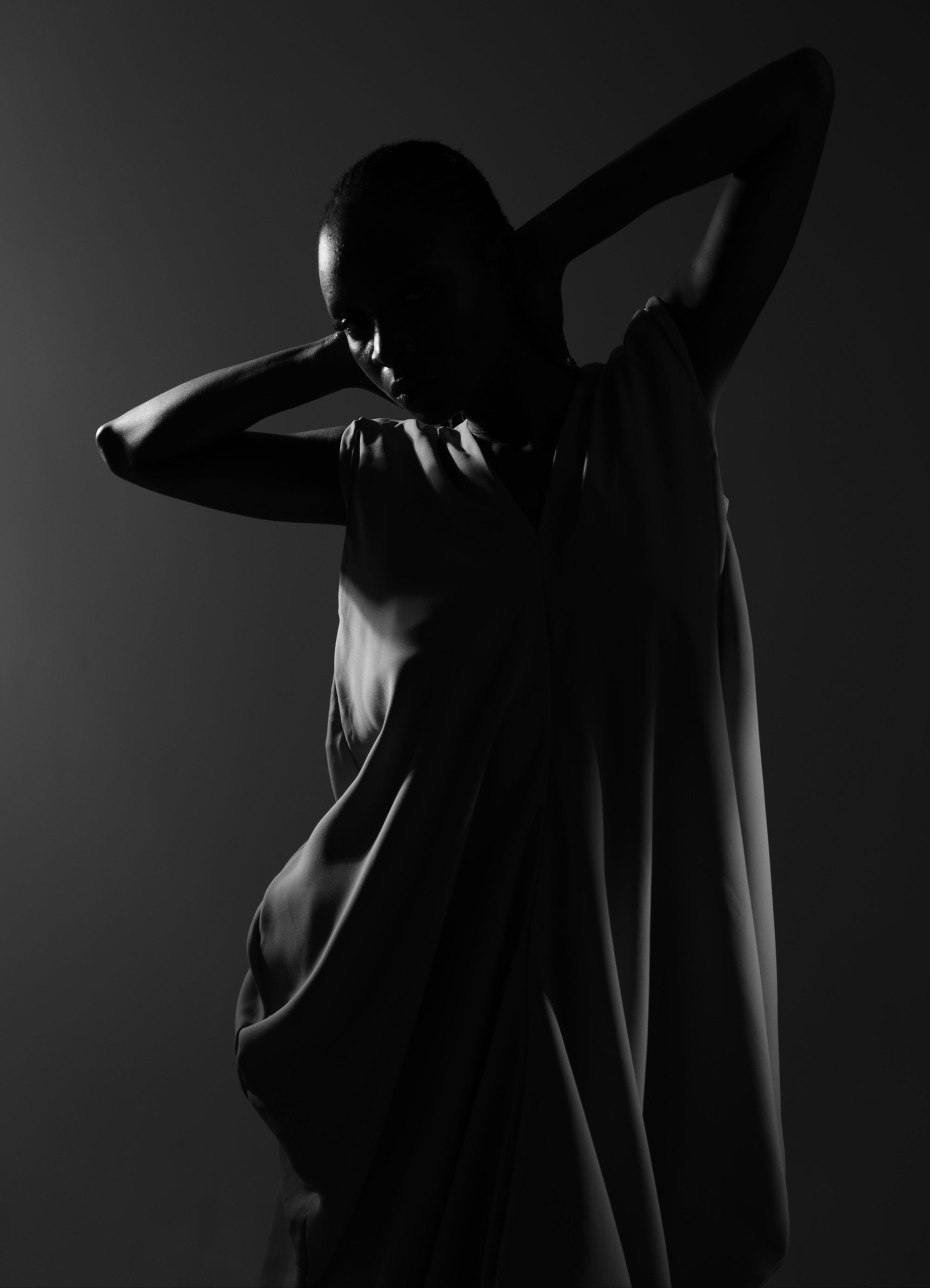 Silhouette of a person against a dark background